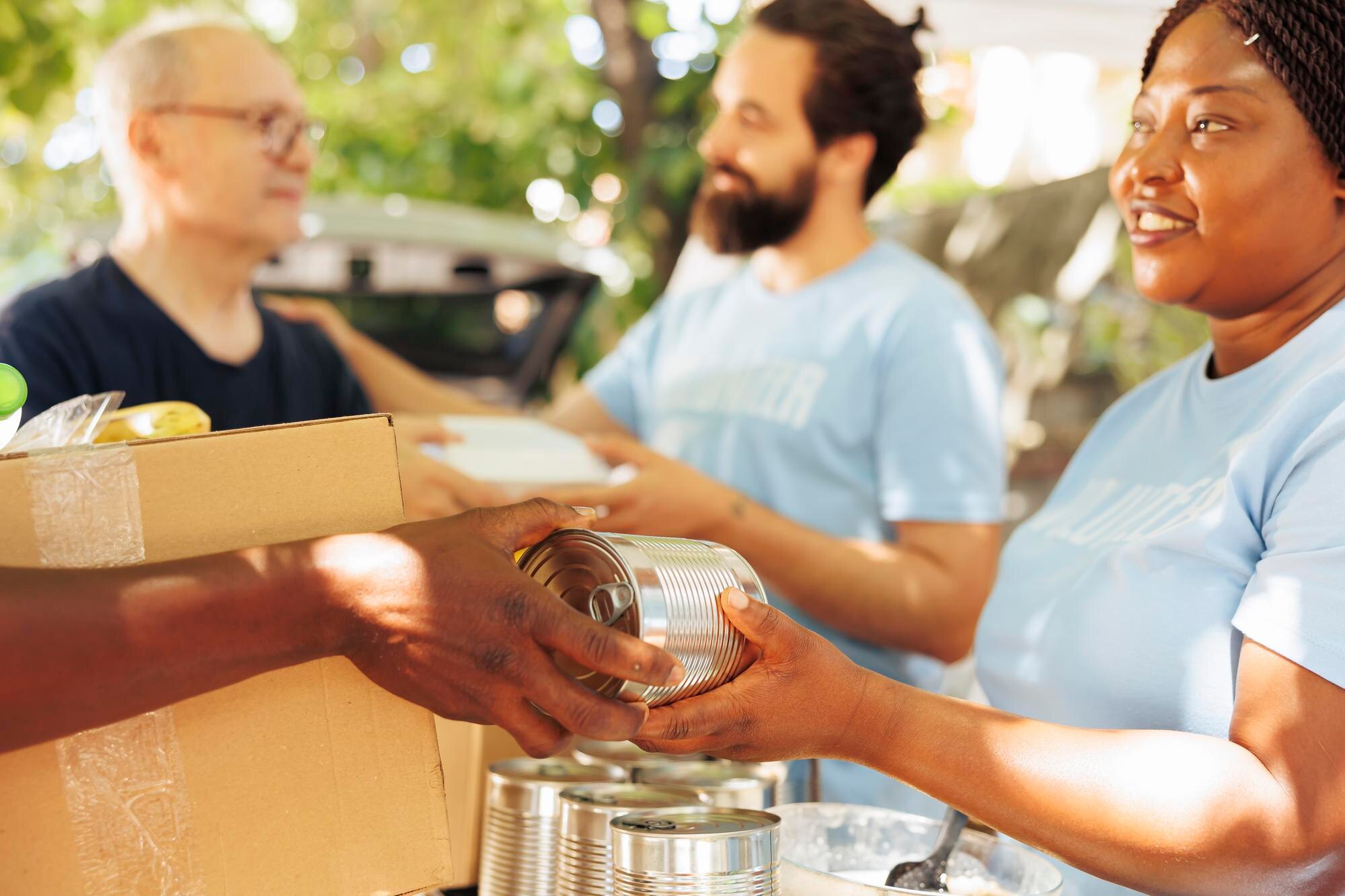 Volunteers distributing food packages to families in need