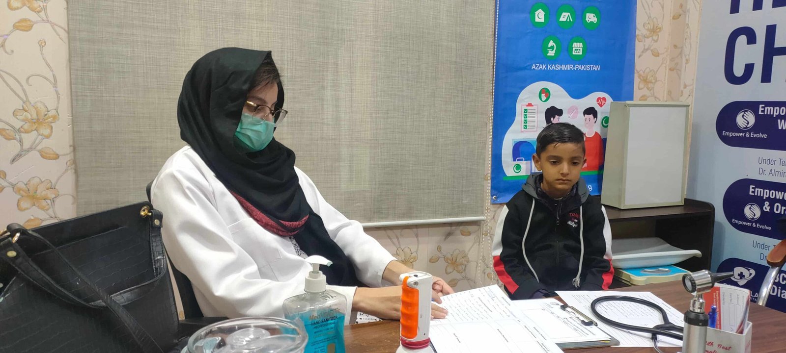 Female doctor consulting with a young patient at the hospital