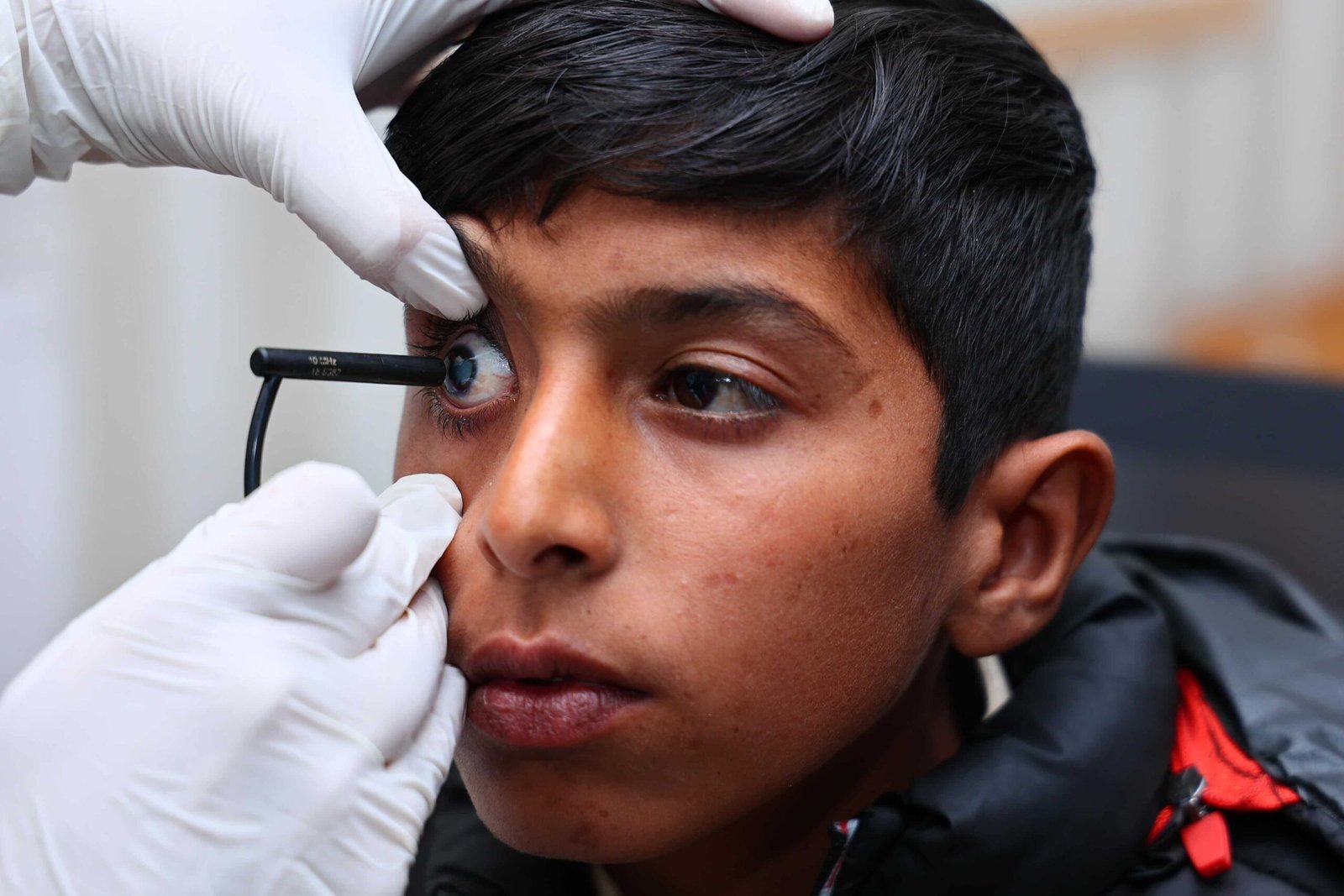 Young boy receiving a detailed eye examination