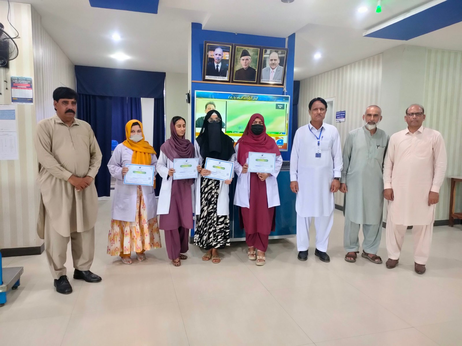 Hospital staff receiving recognition awards in the main lobby