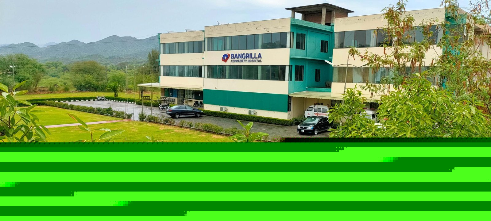 Bangrilla Community Hospital building with the Kashmir mountains in the background