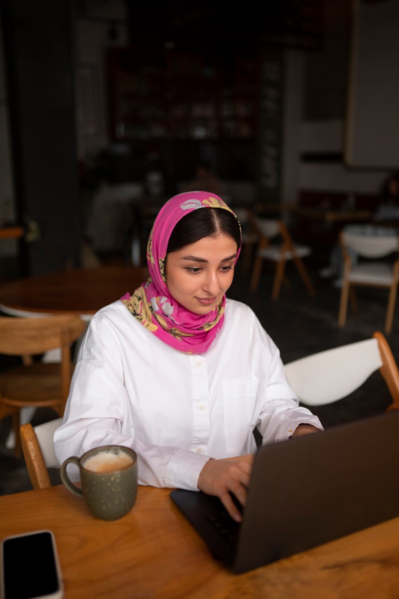 Muslim woman working on her business